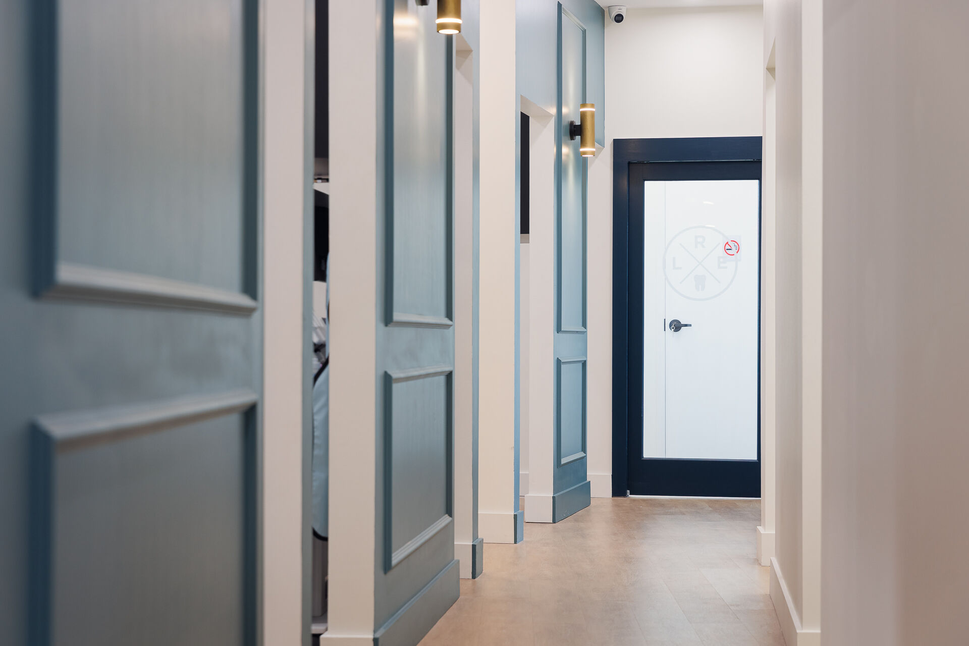 Clean, modern hallway leading to treatment rooms